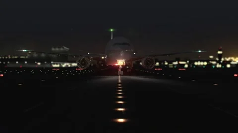 The plane is taxiing at the airport the night before take-off. View of the ru Stock Footage 200122218