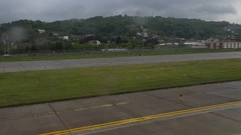 The plane taxis on the track. From the window Video stock 89071500