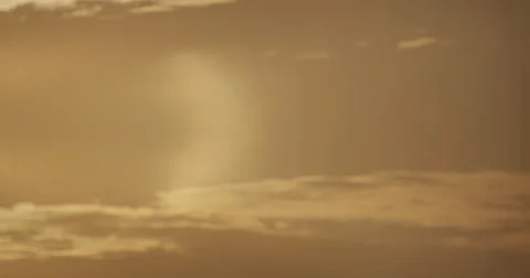 Plane through clouds and sun Stock Footage