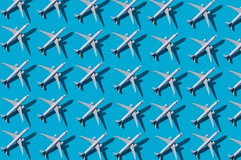 Plane top view. Blue background. Pattern from planes on a blue background. Fl Stock Photos