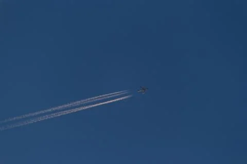 Plane track on the sky Stock Photos