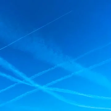 Plane trails in the sky Stock Photos