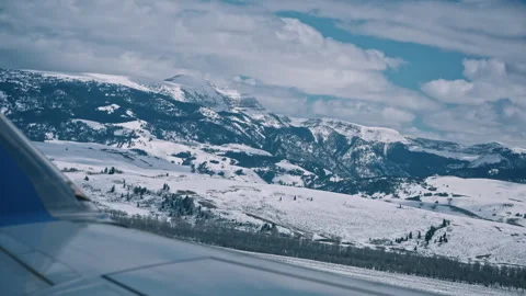 Plane View over Snow Covered Valley Grand Teton Jackson Hole Stock Footage 313483442