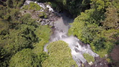 Plane view of waterfall in the jungle, at the bottom of it there is a lake with Stock Footage 103351083