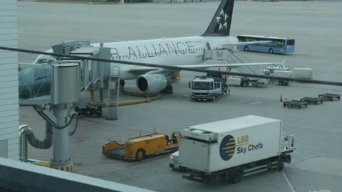 Plane waiting at gate being refueled Stock Footage 96088667
