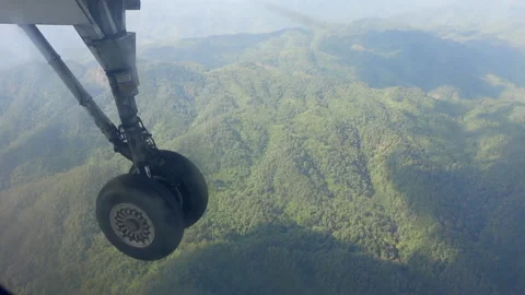 Plane wheel after take off passenger point of view from window seat with lu.. Stock Footage 229923885