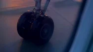Plane Wheel Taxiing On Airport Tarmac At Night. Stock Footage
