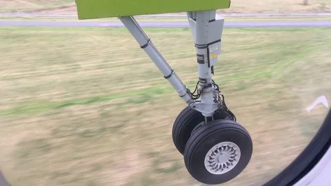 Plane Wheels Close Up Landing Passenger Window Stock Footage 119333624