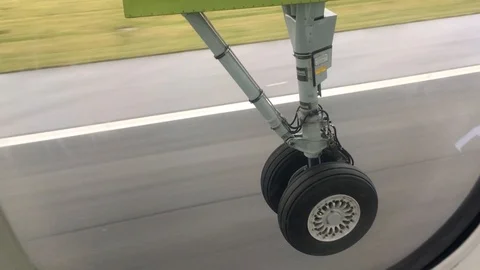 Plane Wheels Landing Passenger Window Slow Motion Stock Footage 119333628