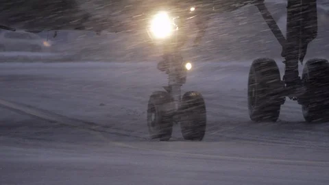 Plane wheels on runaway in heavy snowfall Stock Footage 89887445