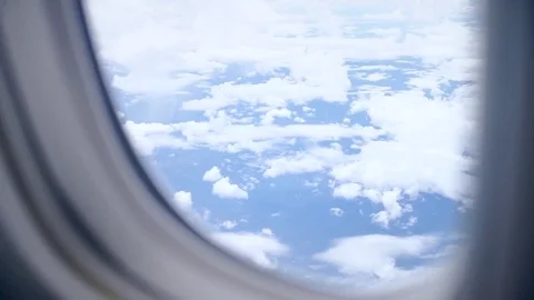 Plane window aerial view Stock Footage 77753909