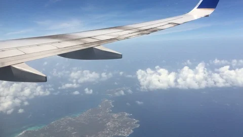 Plane Window Flying Above Clouds Stock Footage 129054551