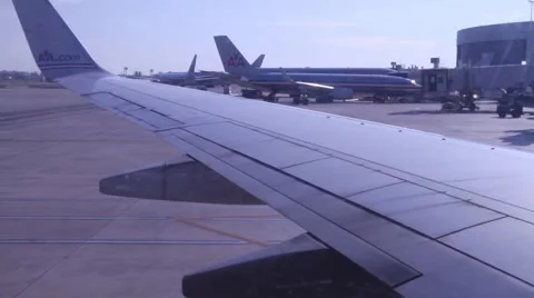 Plane window to kid reading safety instructions Stock Footage 973230