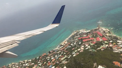 Plane Window Taking Off from Beach Stock Footage 129054561
