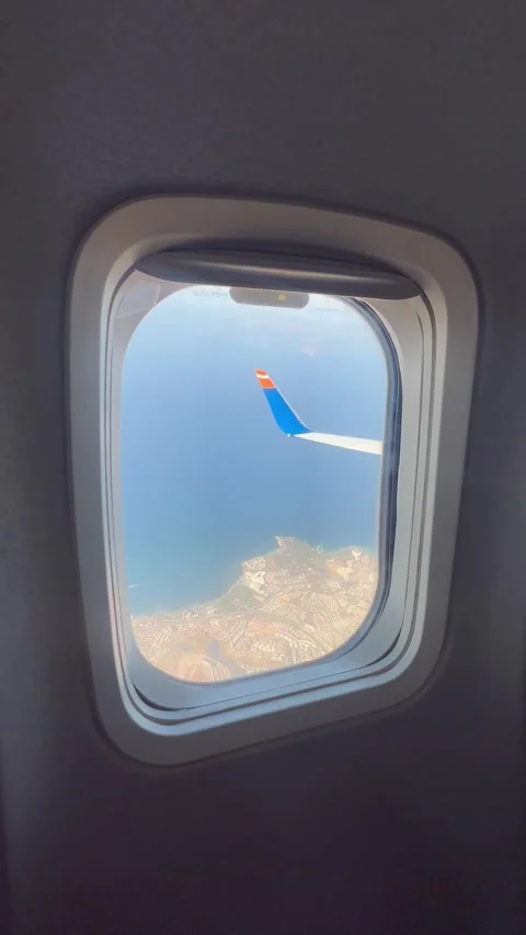 Plane window view in air during flight Stock Footage 344466575