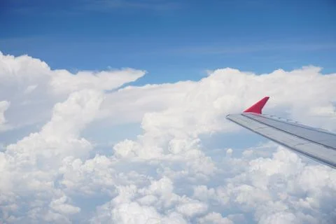 Plane window view with blue sky and sea Stock Photos