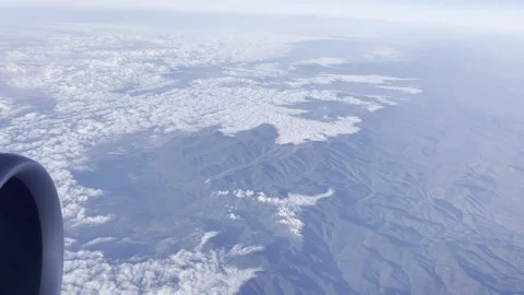 Plane Window View of Clouds and Mountains 動画素材 167429313
