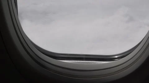 Plane window view of clouds Stock Footage 241095497