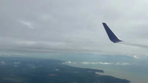 Plane window view fly over Phuket Island in Thailand Southeast Asia travel Stock Footage 340543290