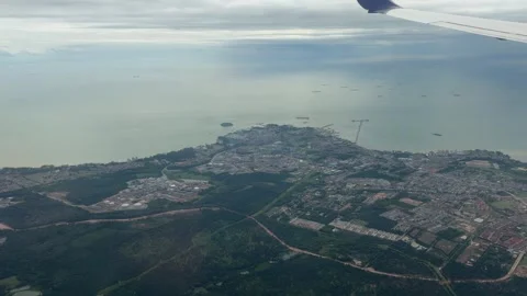 Plane window view fly over Phuket Island in Thailand Southeast Asia travel Stock Footage 340543313