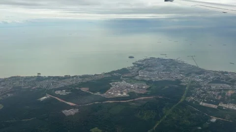 Plane window view fly over Phuket Island in Thailand Southeast Asia travel Stock Footage 340543326