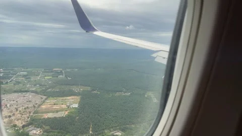Plane window view fly over Phuket Island in Thailand Southeast Asia travel Stock Footage 340543330