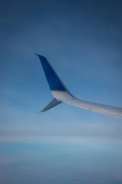 Plane Wing Above The Clouds Stock-Fotos