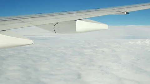 Plane wing above clouds, travel and flight by airplane, aerophobia and aviation. Stock Footage 346531858