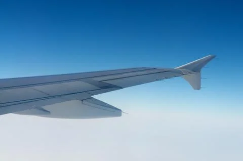Plane wing above sky Stock Photos