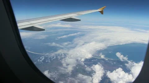 Plane wing in air with window in shot Stock Footage 21248931