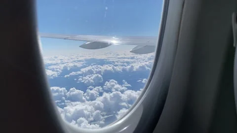 Plane wing and thick clouds from airplane window Video stock 161095323