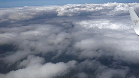Plane wing with carpet of clouds at different height Stock Footage 113030861