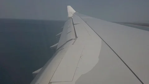 Plane wing close-up, plane goes to land at Phuket airport Stock Footage 126927373
