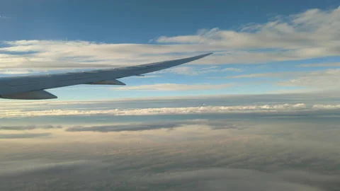 Plane wing clouds blue sky in the air Видео 221593463