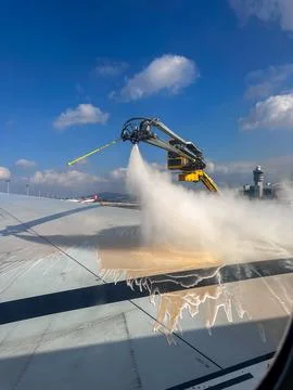 Plane wing defrosting machine in action. Stock Photos