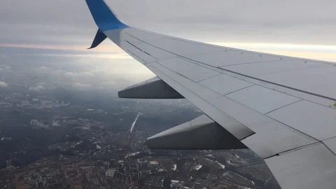 Plane wing flying town clouds IMG 6449 Stock Footage 108082658