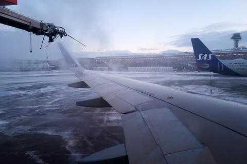 A plane wing is getting de-iced Foto stock