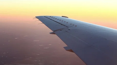 Plane wing over countryside at sunset Video stock 74093788