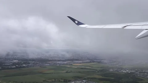 Plane wing shaking while ascending through storm clouds Stock Footage 345310246