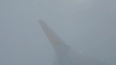 Plane wing through clouds Stock Footage 346509794