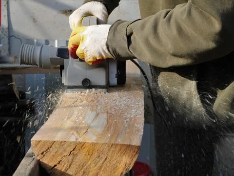Planer work with sawdust making Stock Photos