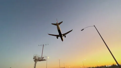 Planes come in for Landing at LAX at Sunset with Sound Stock Footage 198954557