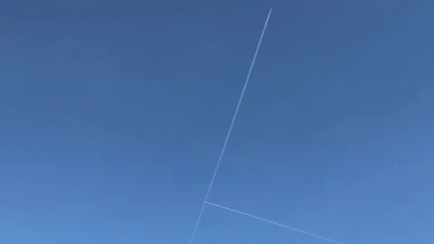 Planes cross on a blue sky Stock Footage 88145843