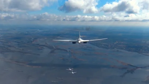 Planes fly over the river Stock Footage 89651190