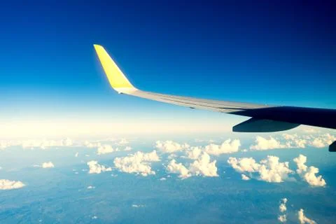 Planes flying over a cloudy sky. Stock Photos