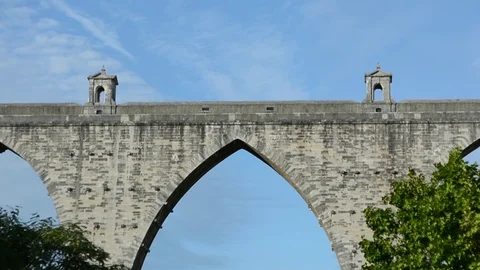 Planes flying really close to city centre, frame with ancient roman aqueduct in Stock Footage 118667003