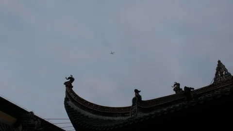 Planes skimming over the eaves of ancient Chinese traditional buildings Stock Footage 123978770