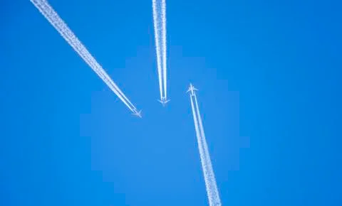 Planes in the sky-inversion trail Stock Photos