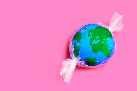 Planet Candy: Globe Wrapped in Plastic 스톡 사진