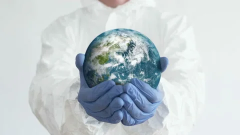 Planet in Doctors Hands. Close-Up Shot. Coronavirus Concept Video stock 142756647